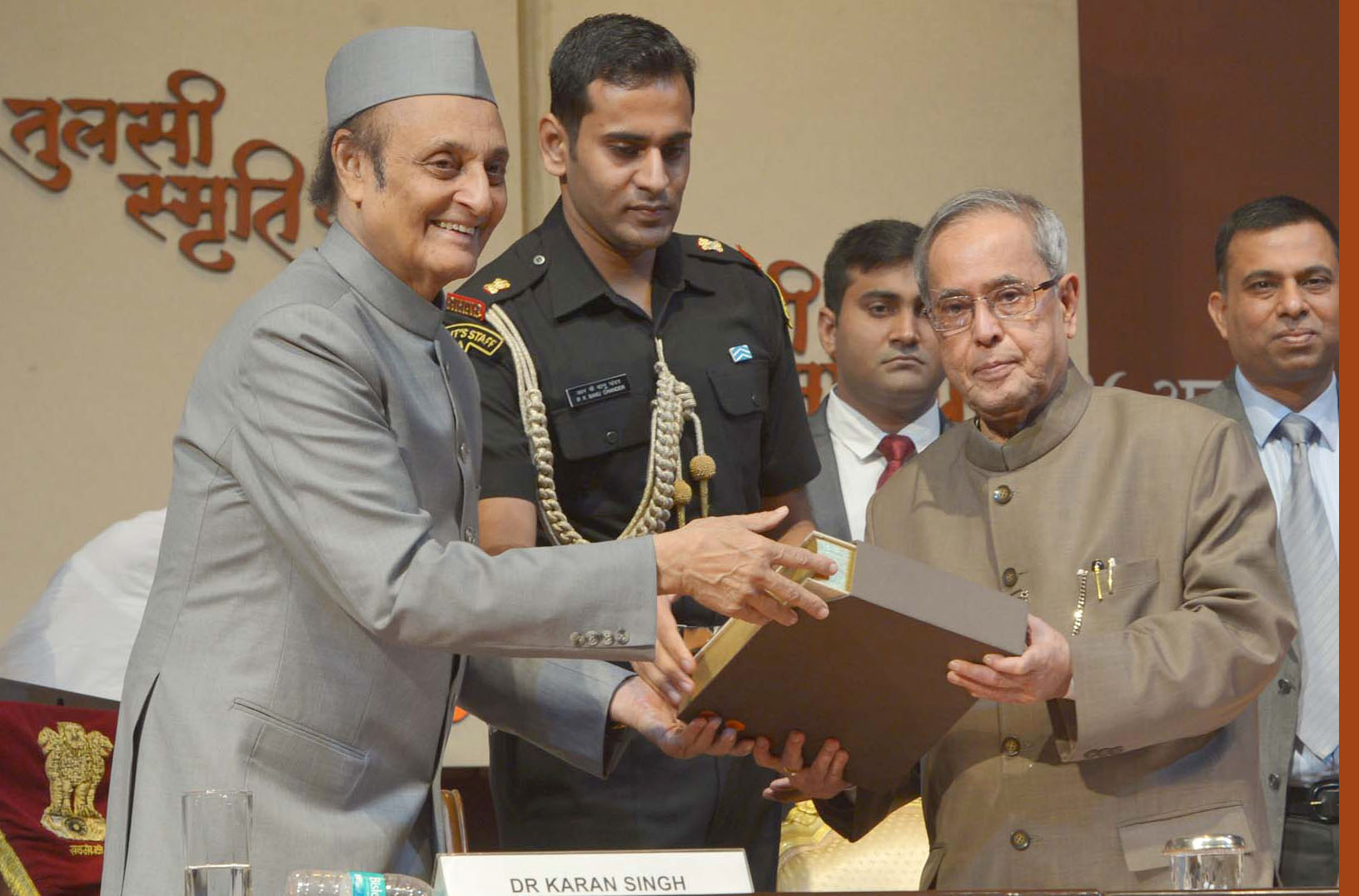 President Pranab Mukherjee receiving  “Tulsi Smriti Granth”