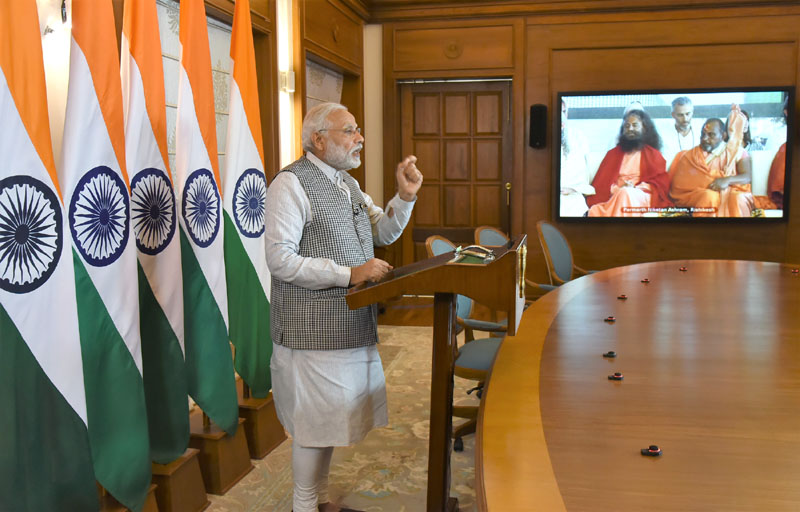 PM Modi addressing the inaugural function of Annual International Yoga Festival at Rishikesh, through video conferencing